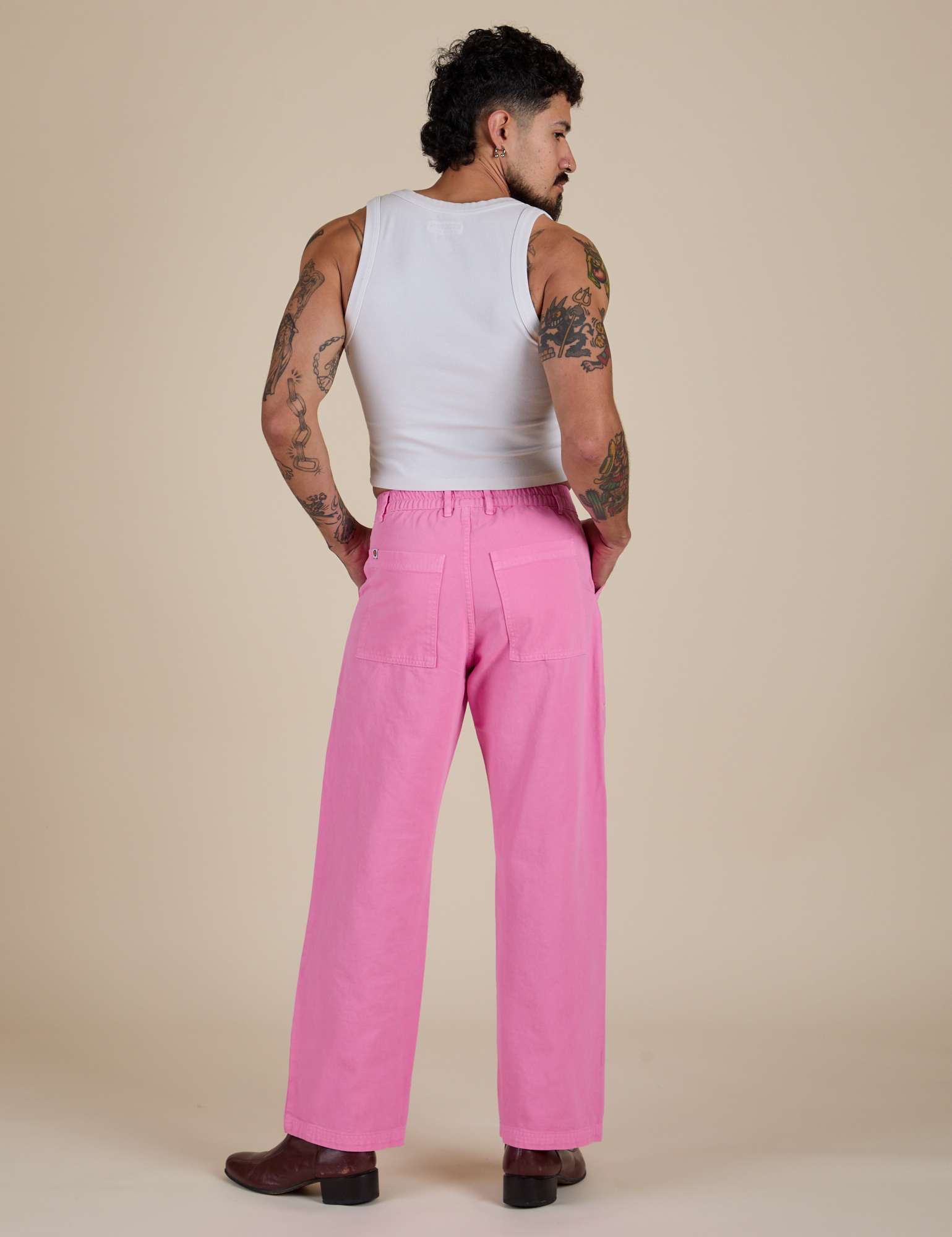 Back view of Work Pants in Bubblegum Pink and vintage tee white Cropped Tank on Jesse