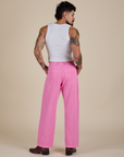 Back view of Work Pants in Bubblegum Pink and vintage tee white Cropped Tank on Jesse
