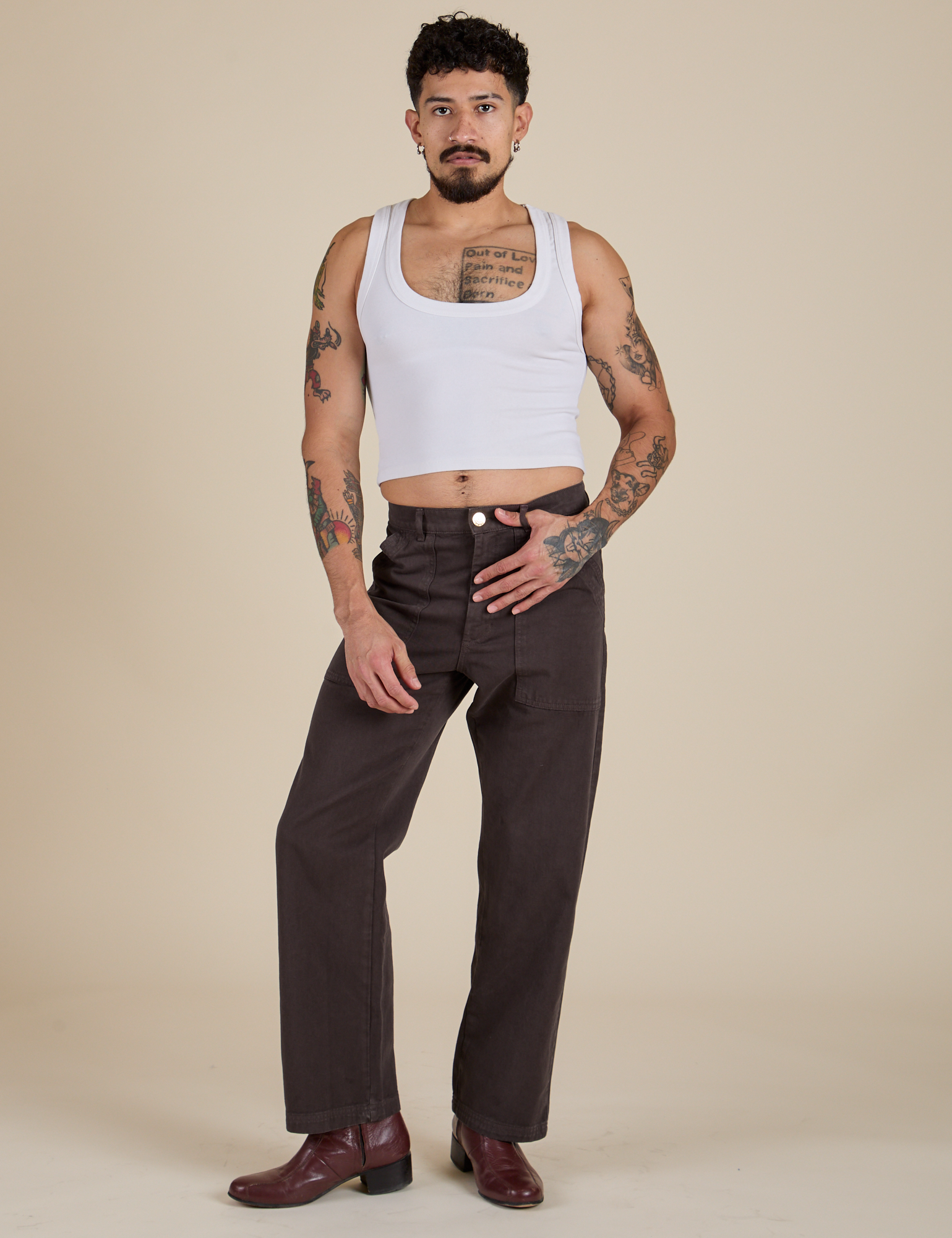 Jesse is 5’8” and wearing S Work Pants in Espresso Brown paired with a vintage tee white Cropped Tank