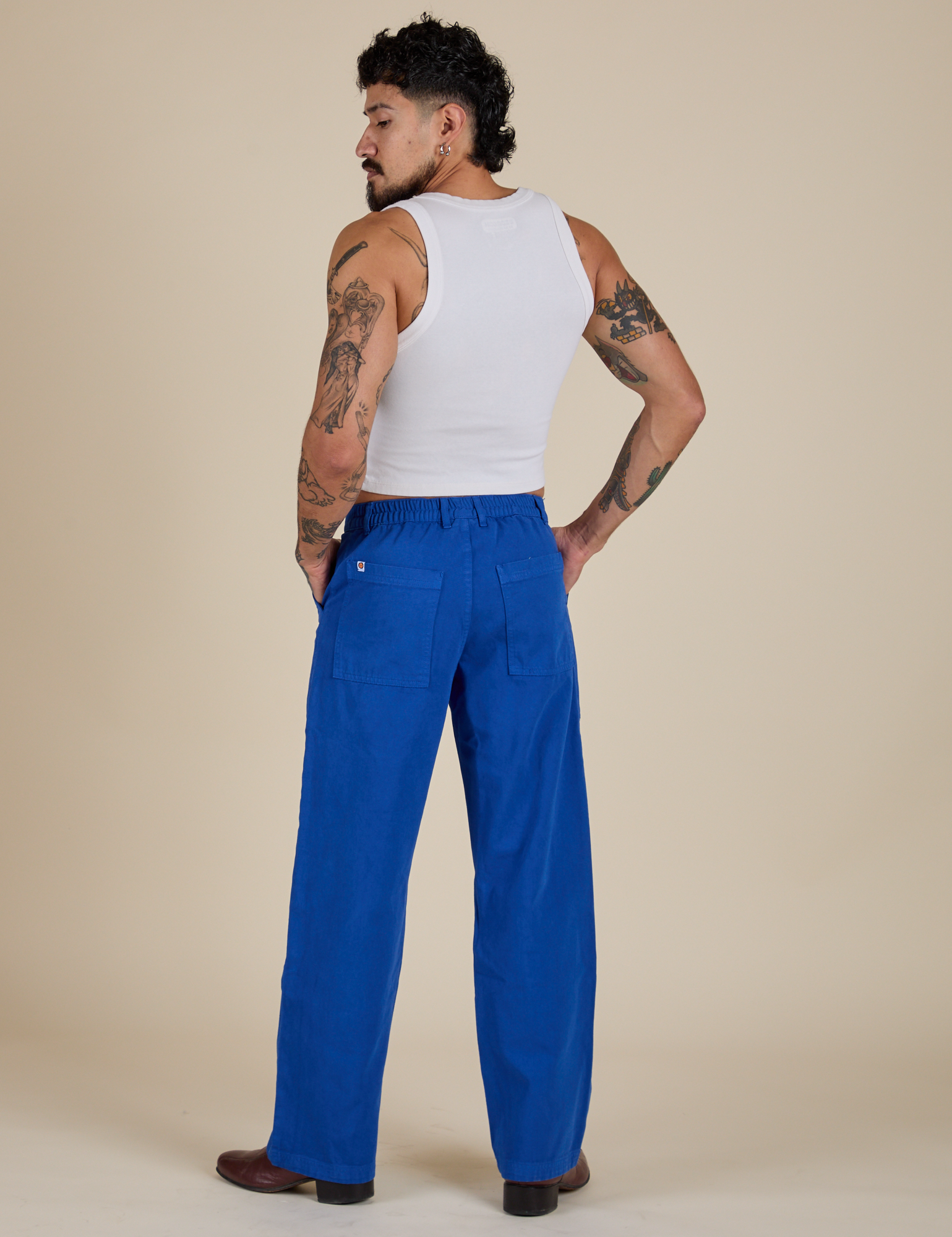 Back view of Work Pants in Royal Blue and Cropped Tank in Vintage Tee White on Jesse