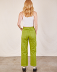 Back view of Work Pants in Gross Green and Cropped Tank in vintage tee off-white on Margaret