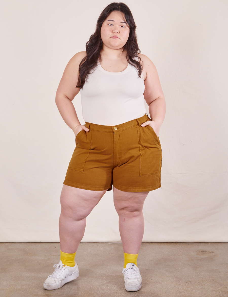Ashley is wearing Classic Work Shorts in Spicy Mustard and vintage off-white Tank Top