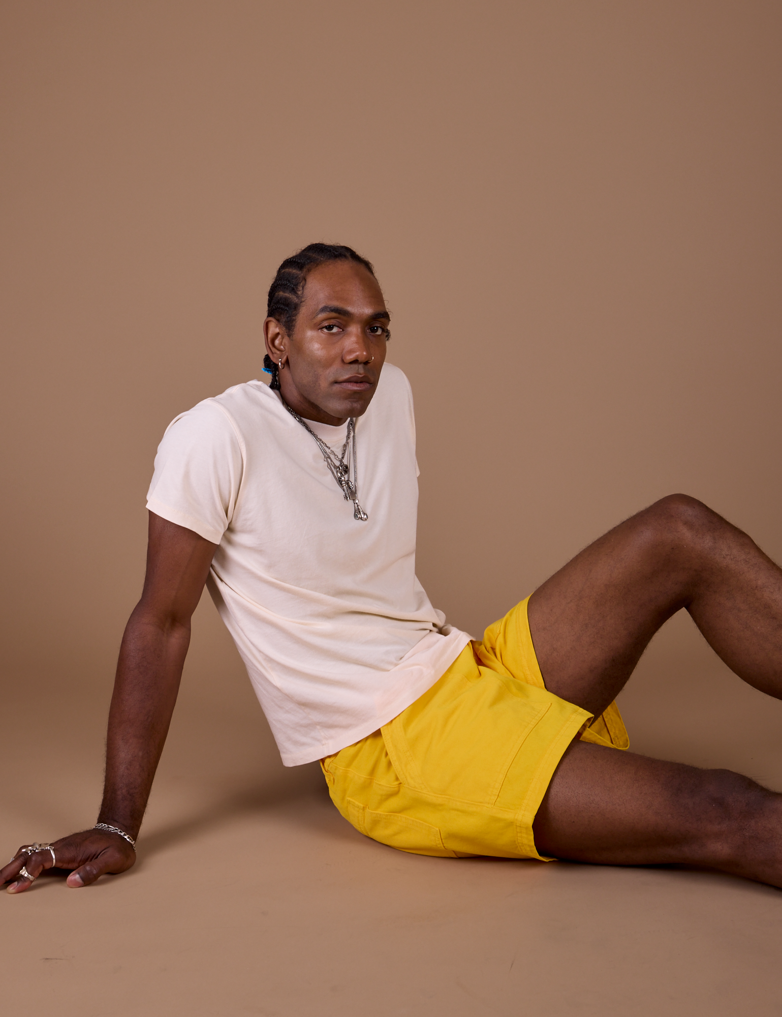 Jerrod is wearing Classic Work Shorts in Sunshine Yellow and Organic Vintage Tee in Vintage Off White