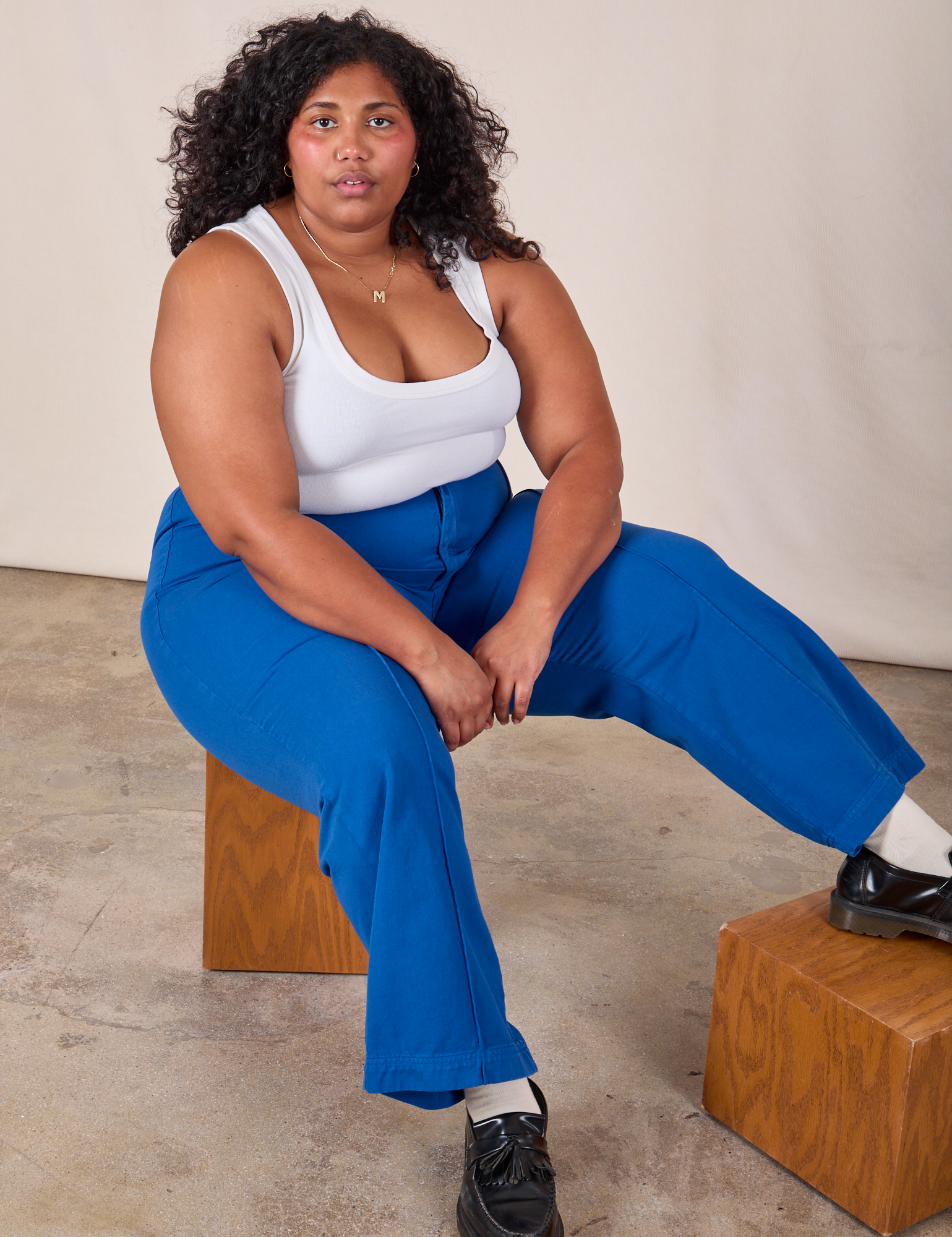 Morgan is wearing Western Pants in Royal Blue and Cropped Tank in Vintage Tee Off-White