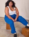 Morgan is wearing Western Pants in Royal Blue and Cropped Tank in Vintage Tee Off-White