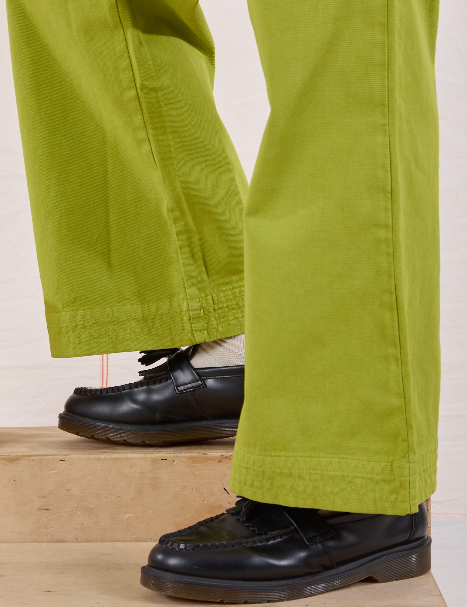 Action Pants in Gross Green pant leg close up on Isaac