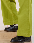 Action Pants in Gross Green pant leg close up on Isaac