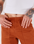 Action Pants in Burnt Terracotta front close up on Jesse