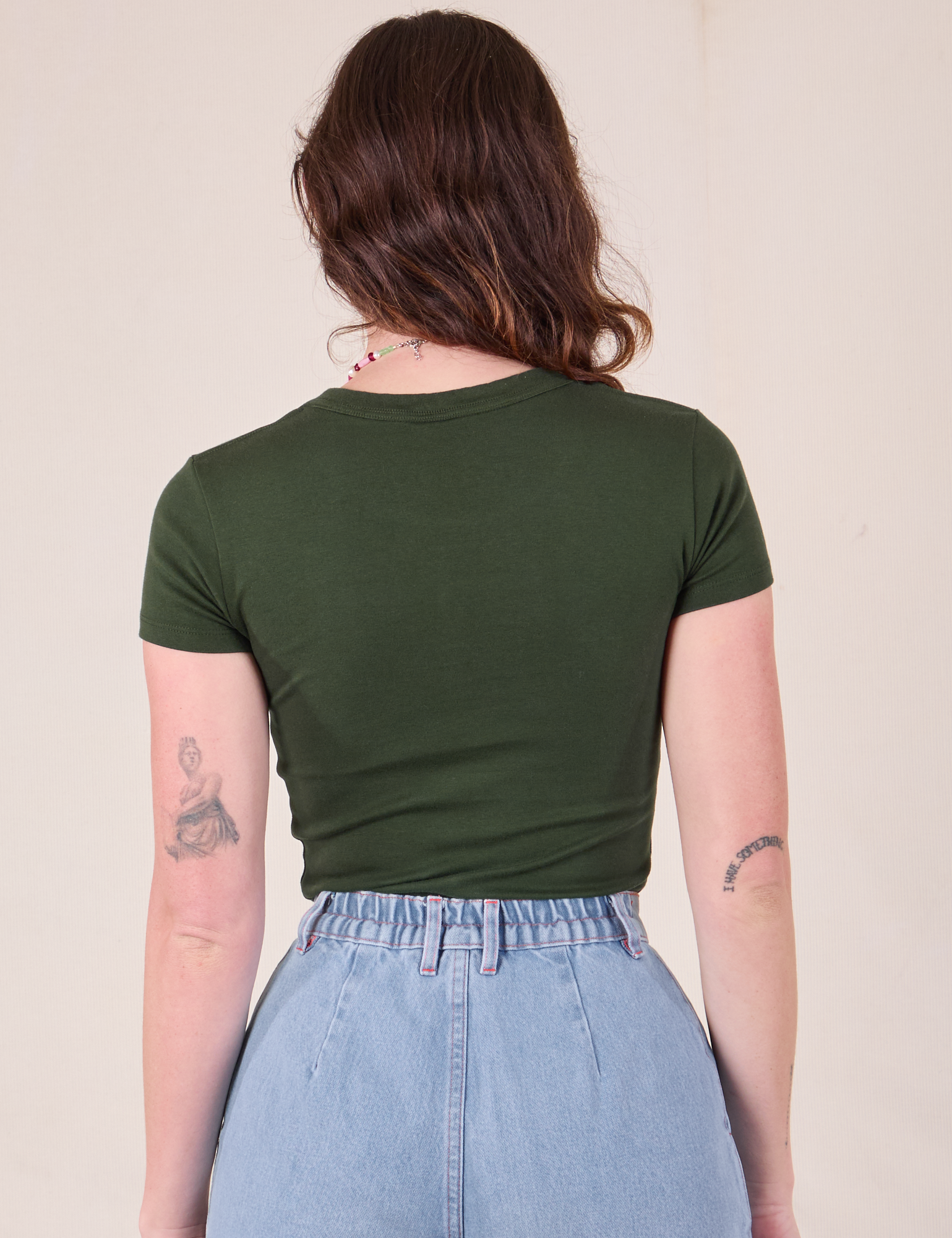 Baby Tee in Swamp Green back view on Alex