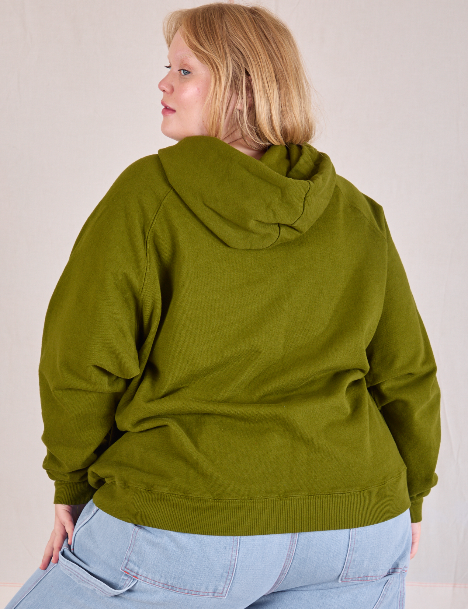 Collegiate Hoodie in Summer Olive back view on Juliet