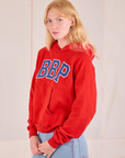 Collegiate Hoodie in Mustang Red angled front view on Margaret