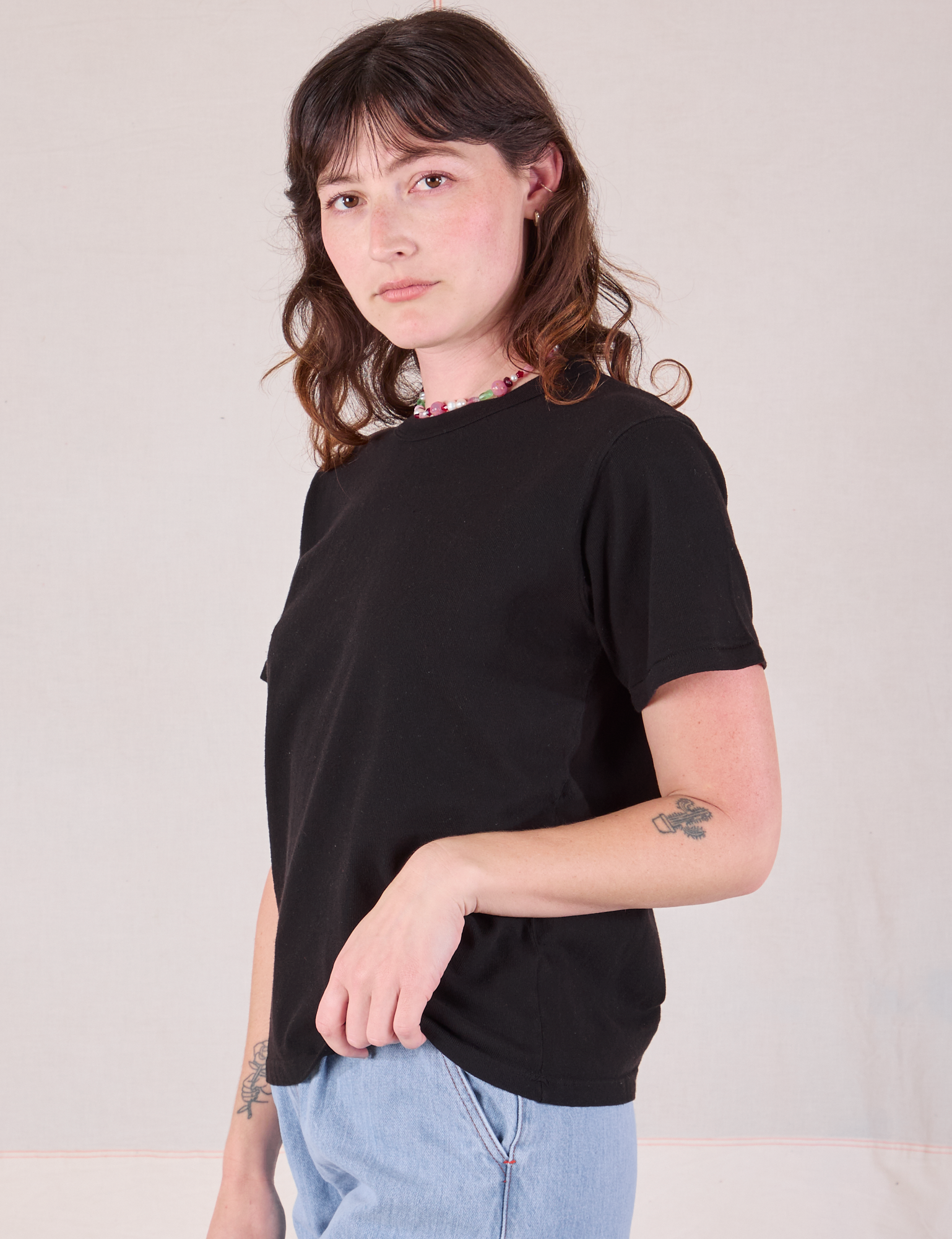 Burly Tee in Basic Black angled front view on Alex