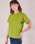 Burly Tee in Gross Green angled front view on Alex