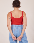 Back view of Cropped Cami in Mustang Red and light wash Sailor Jeans worn by Tiara