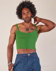 Jerrod is wearing Cropped Cami in Lawn Green and dark wash Carpenter Jeans