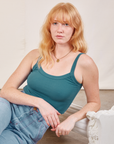 Margaret is wearing Cropped Cami in Marine Blue and light wash Carpenter Jeans