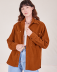 Alex is 5'8" and wearing P Corduroy Overshirt in Burnt Terracotta