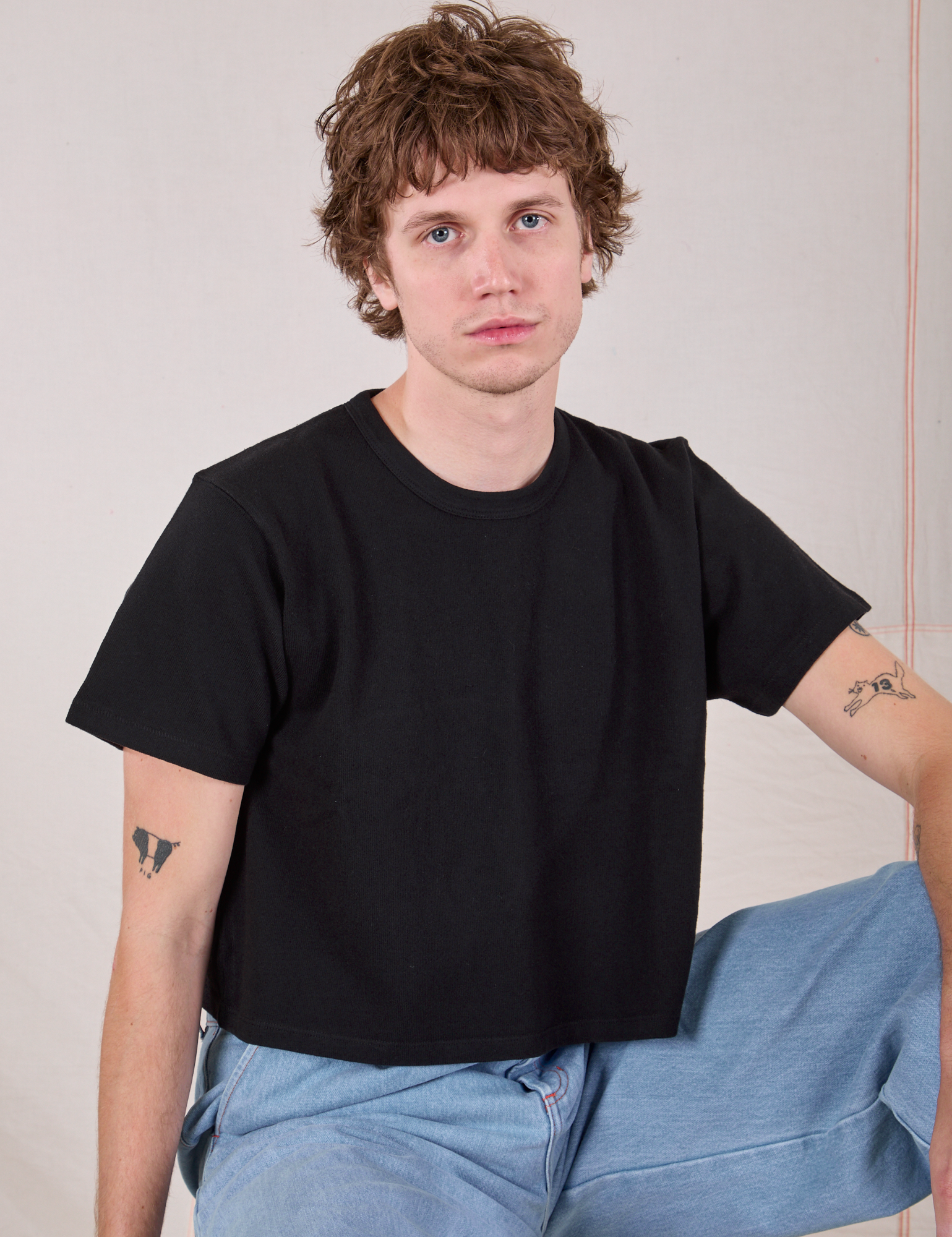 Quinn is wearing Cropped Burly Tee in Basic Black