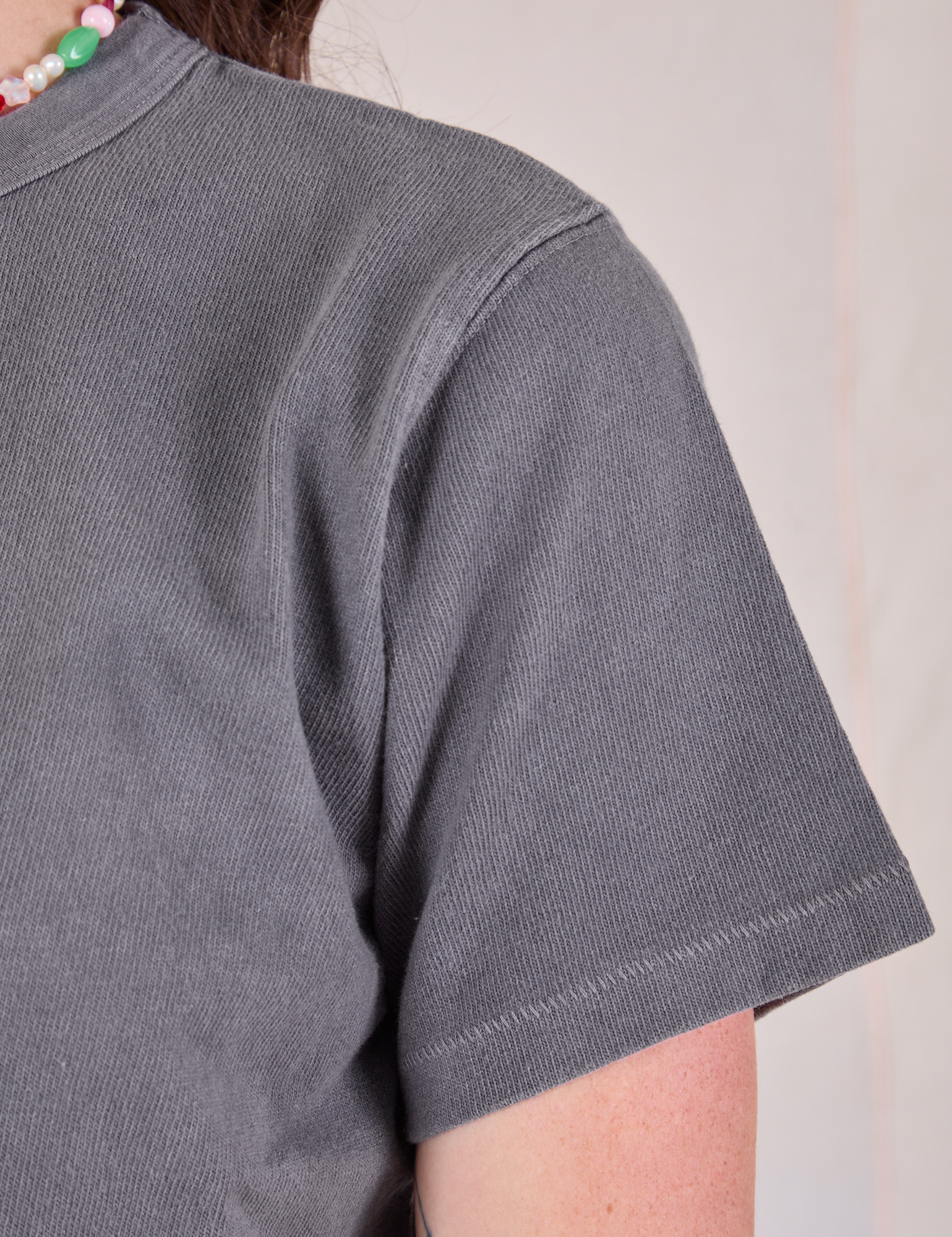 Cropped Burly Tee in Washed Grey sleeve close up on Alex