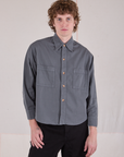 Quinn is wearing a buttoned up Cropped Overshirt in Slate Grey