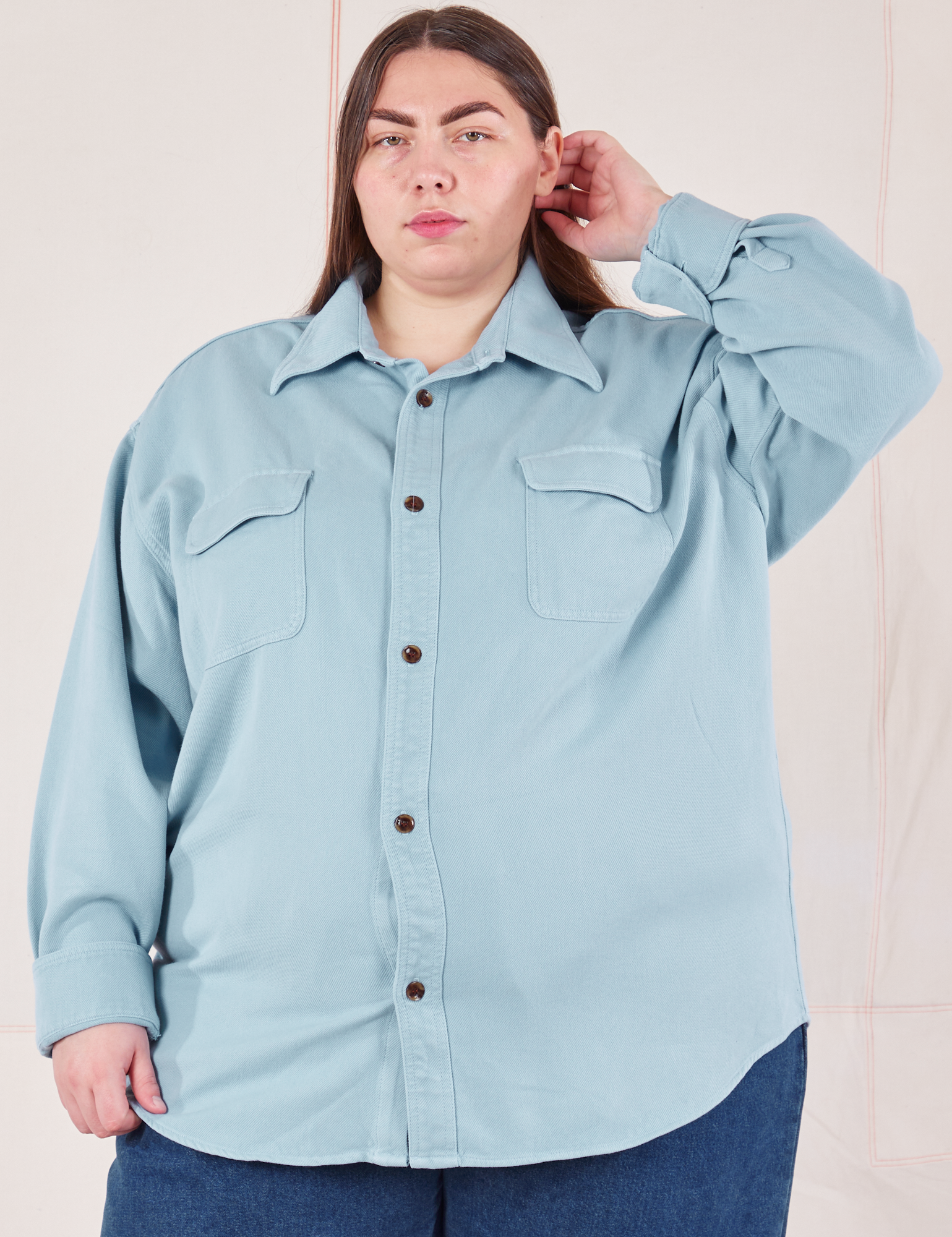 Marielena is wearing a buttoned up Flannel Overshirt in Baby Blue
