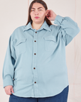 Marielena is wearing a buttoned up Flannel Overshirt in Baby Blue