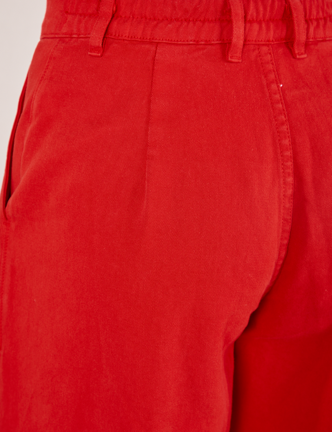 Back view close up of Heavyweight Trousers in Mustang Red worn by Jesse