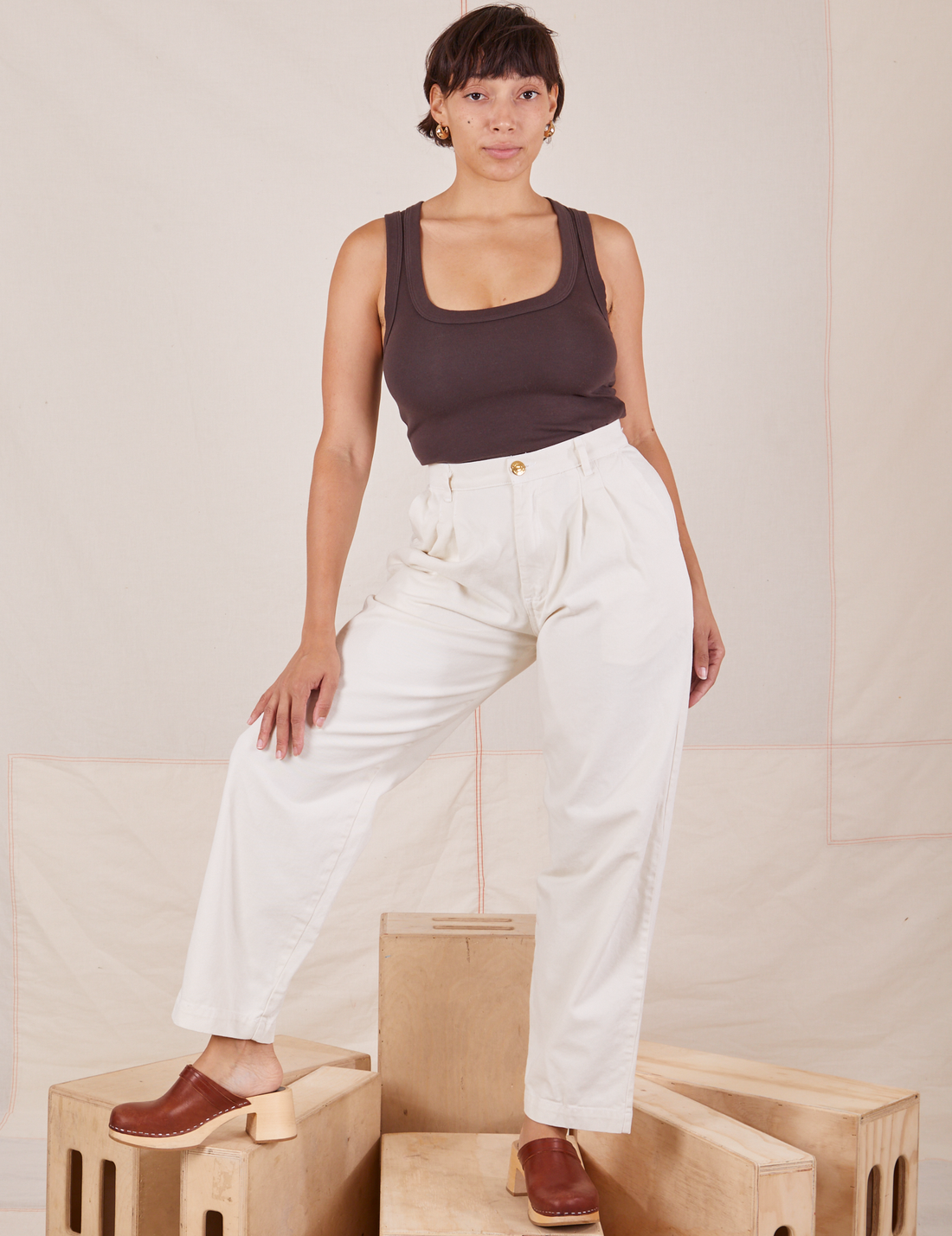 Tiara is 5'4" and wearing S Heavyweight Trousers in Vintage Off-White paired with espresso brown Cropped Tank Top.
