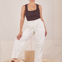 Tiara is 5'4" and wearing S Heavyweight Trousers in Vintage Off-White paired with espresso brown Cropped Tank Top.
