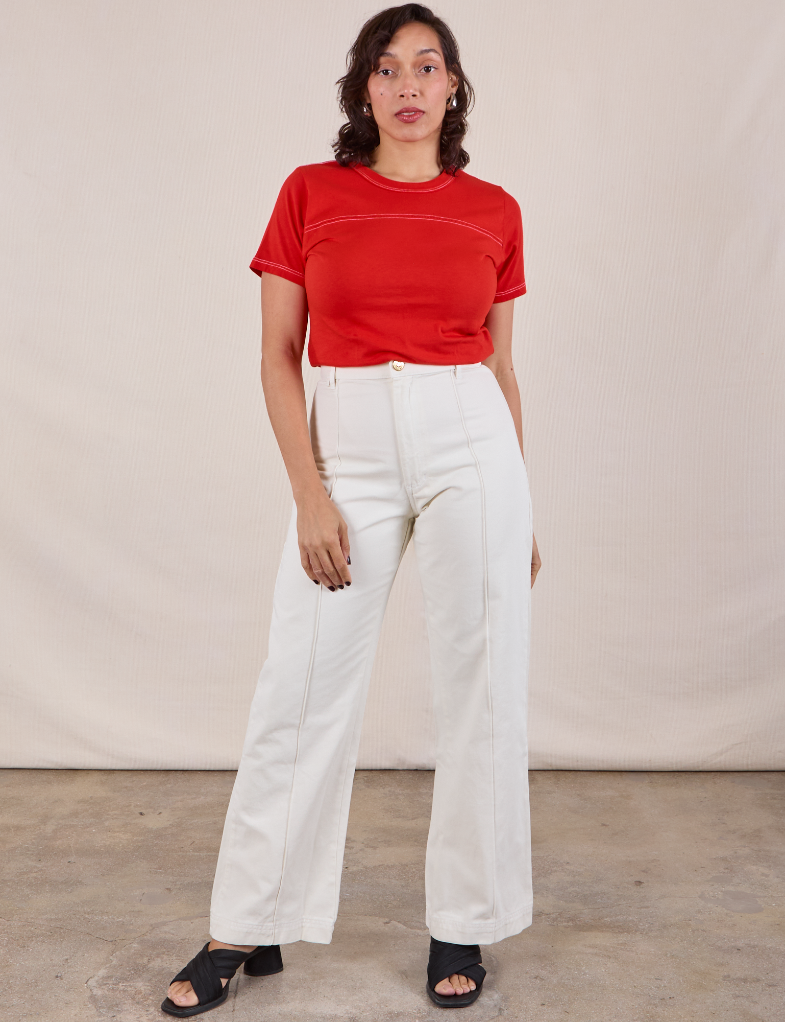 Tiara is 5&#39;4&quot; and wearing XXS JV Tee in Mustang Red paired with vintage tee off-white Western Pants