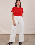 Tiara is 5'4" and wearing XXS JV Tee in Mustang Red paired with vintage tee off-white Western Pants