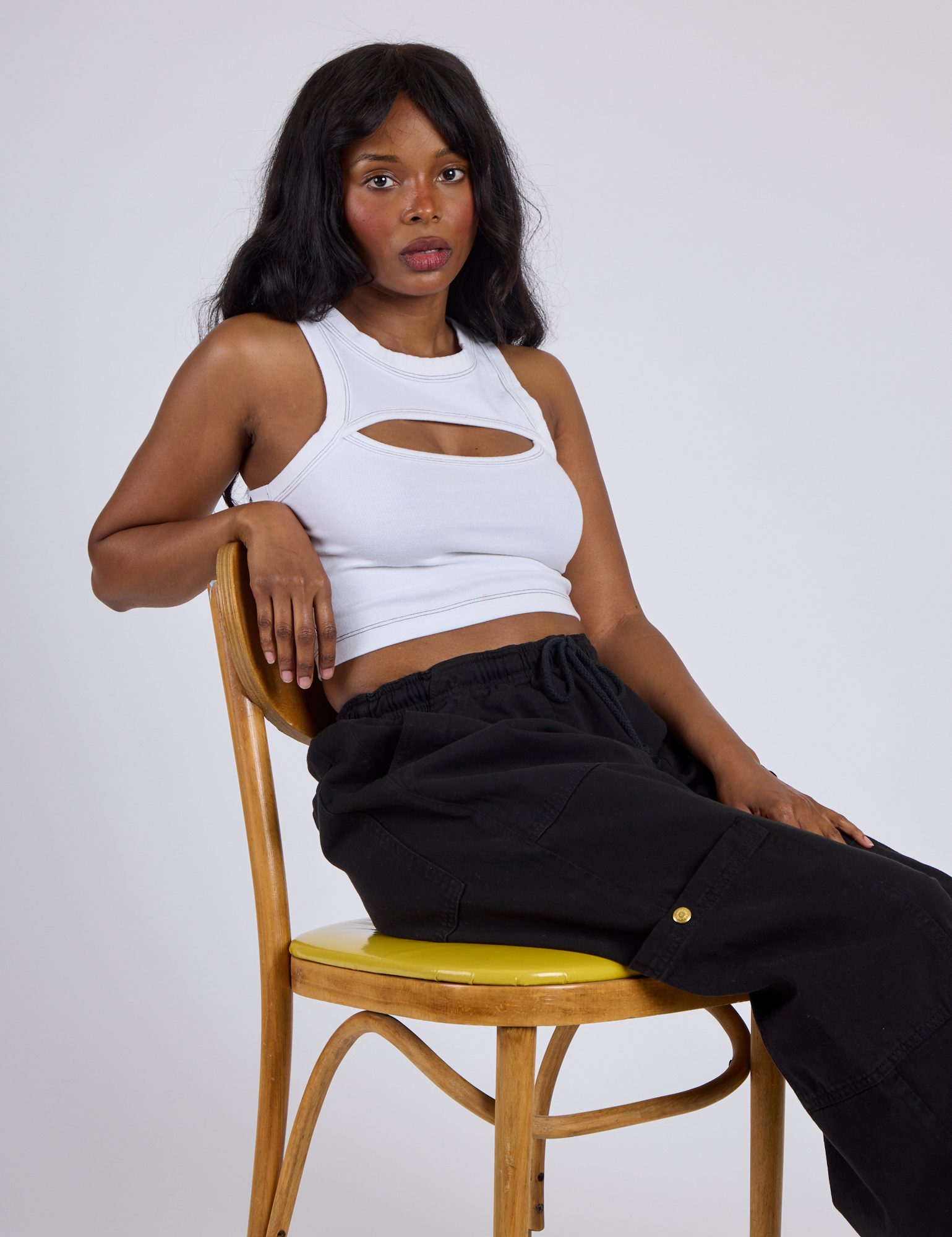 Kandia wearing the Vintage Tee White Porthole Tank and Black Drop Pocket Cargo Pants