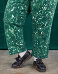 Pant leg close up of Marble Splatter Work Pants in Hunter Green on Sam