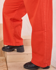 Mid-Rise Pleated Trousers in Chili Red pant leg side view close up on Juliet