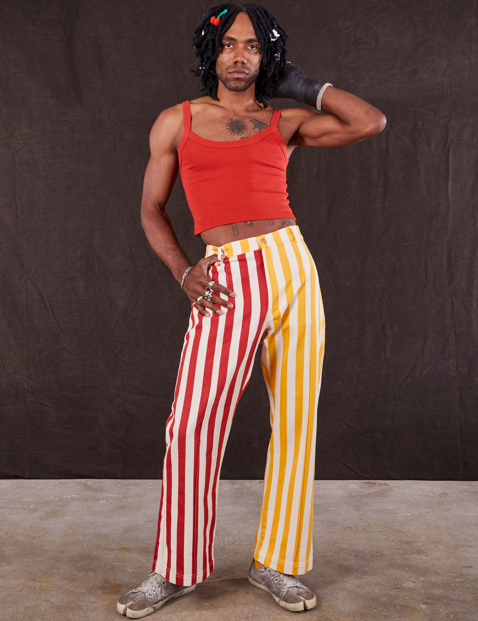 Jerrod is 6&#39;3&quot; and wearing S Western Pants in Ketchup/Mustard Stripes paired with mustang red Cami