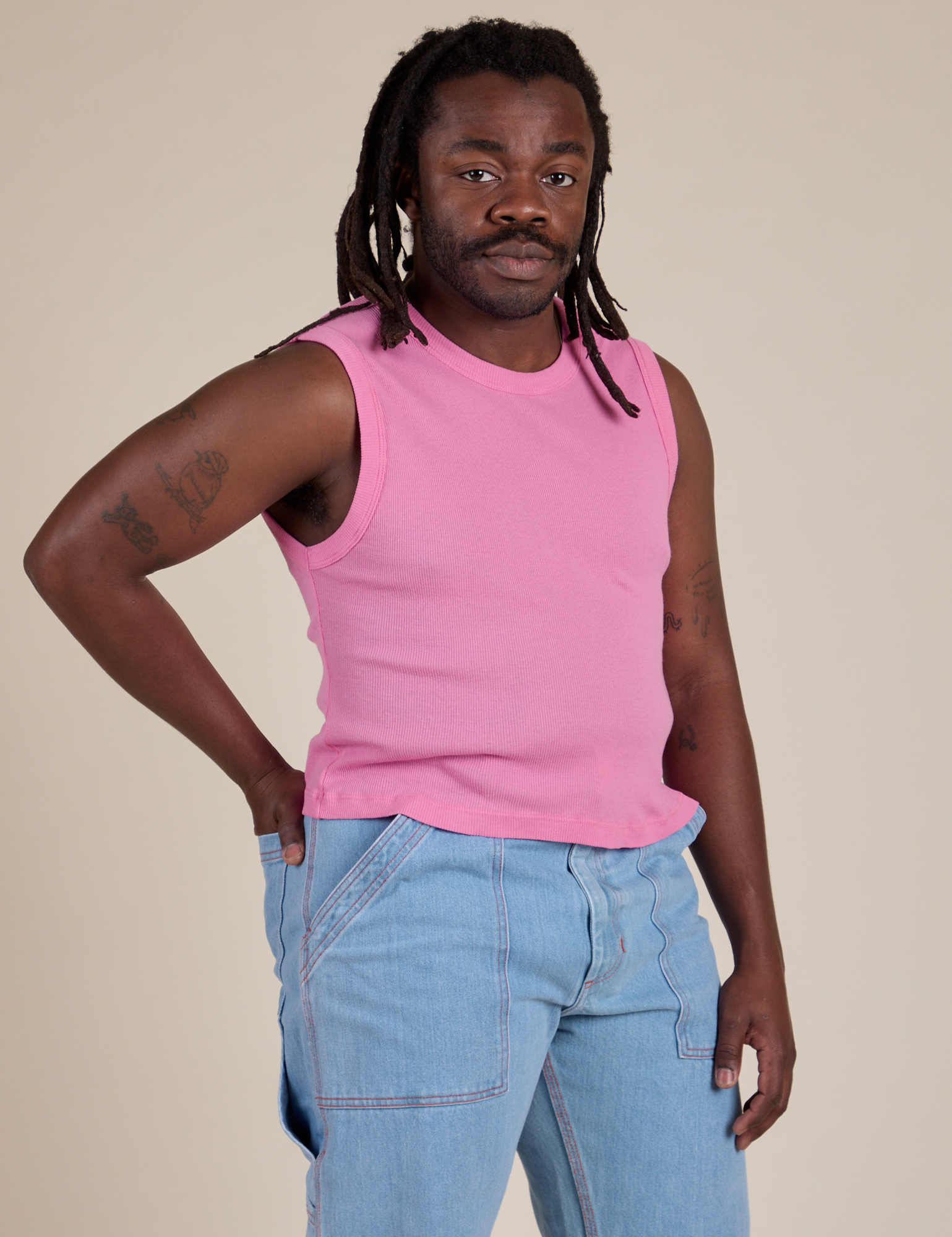 Angled front view of Muscle Tee in Bubblegum Pink on Demi