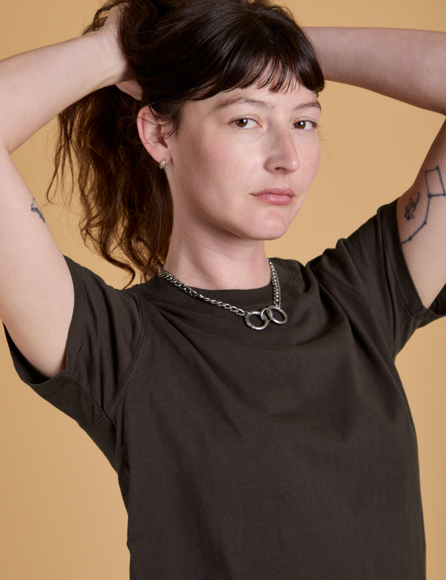 Angled front view of Organic Vintage Tee in Espresso Brown on Alex