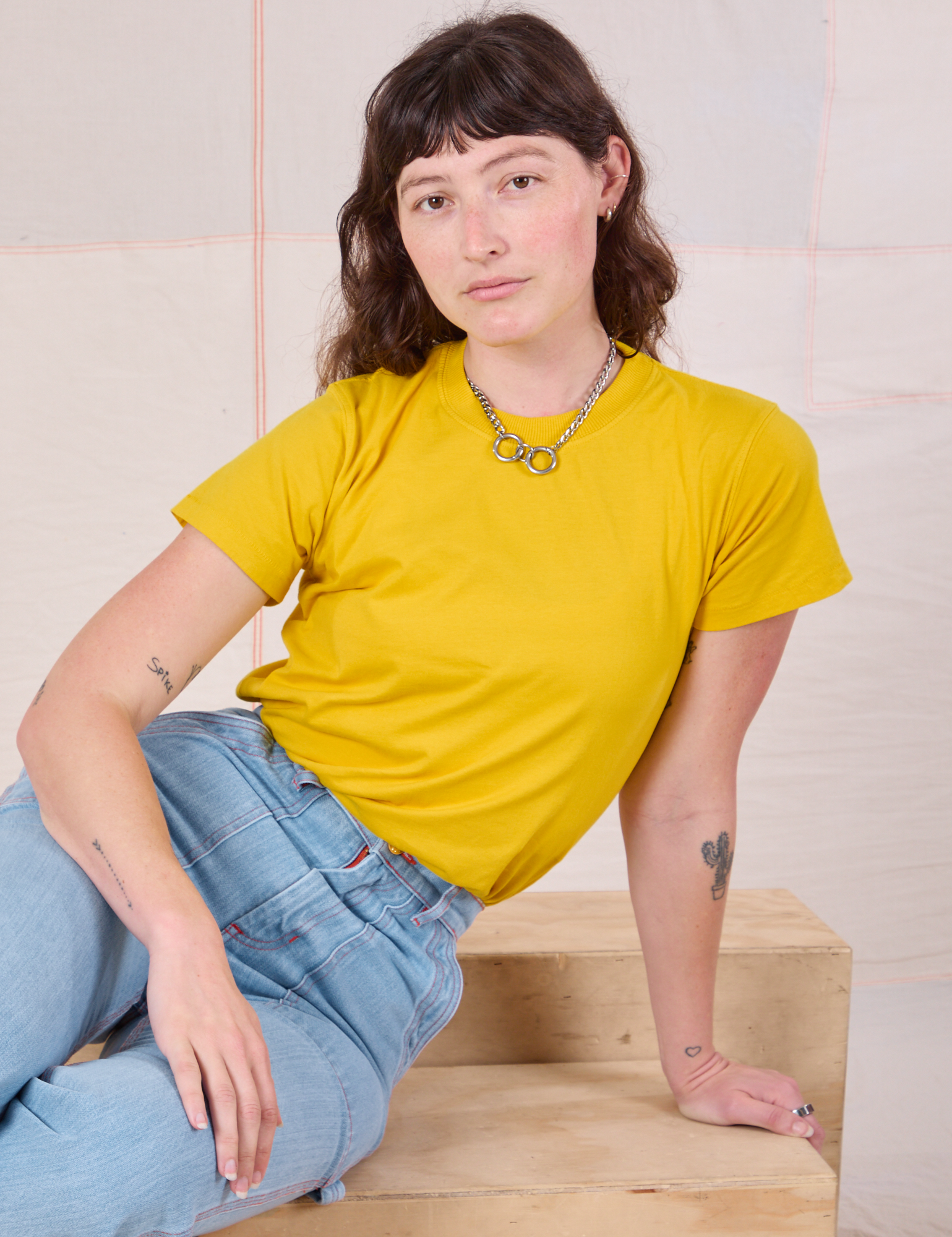 Alex is wearing Organic Vintage Tee in Golden Yellow