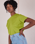 Angled front view of Organic Vintage Tee in Gross Green on Cheyann