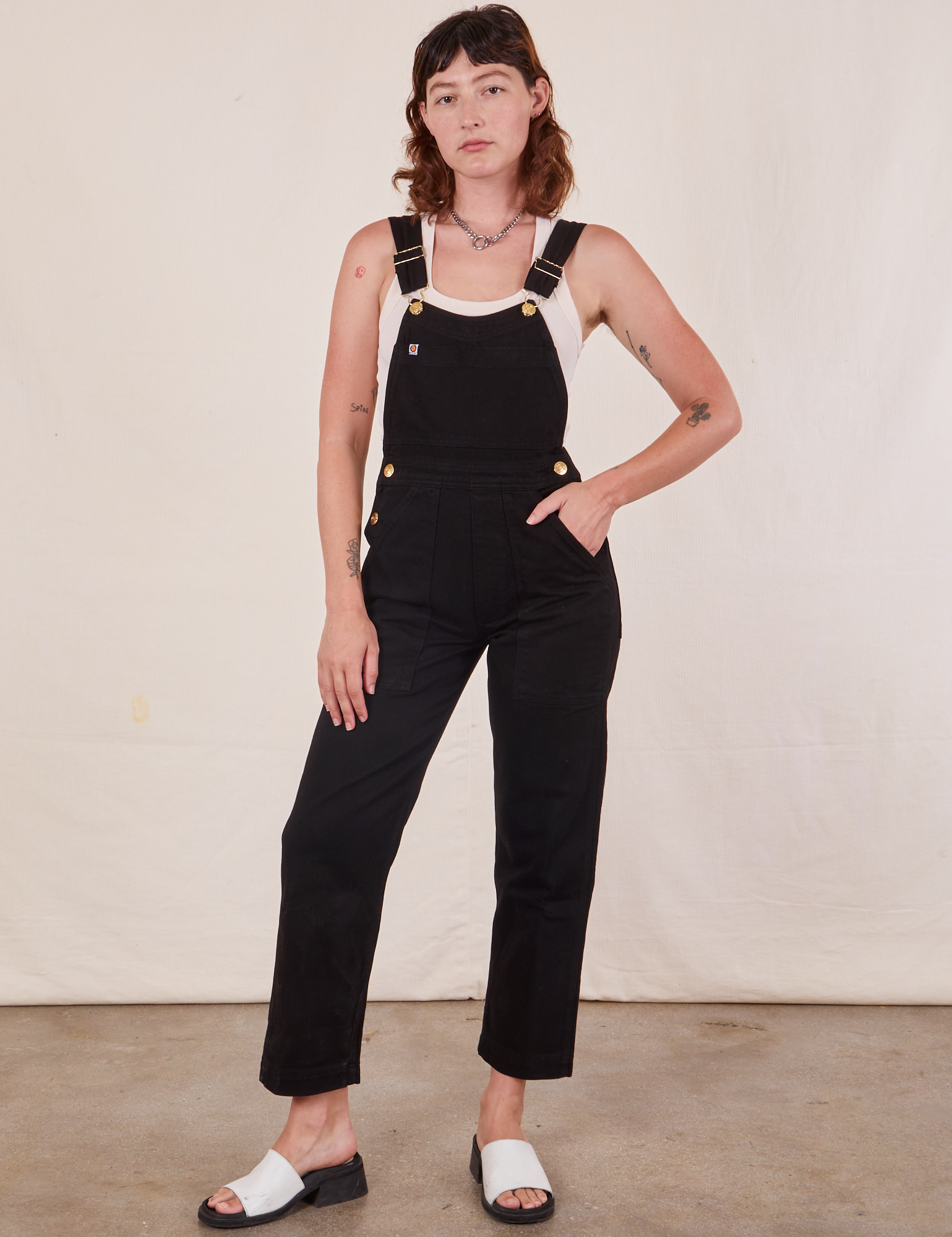 Alex is 5&#39;8&quot;and wearing size P Original Overalls in Mono Black