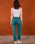 Back view of Overdye Stripe Work Pants in Blue/Green and vintage off-white Cropped Tank Top on Alex