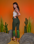 Angled back view of Paintstamped Work Pants in Cactus on Alex