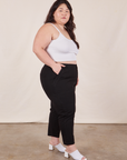 Side view of Petite Pencil Pants in Basic Black and vintage off-white Cropped Cami on Ashley