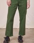 Pant leg close up of Petite Short Sleeve Jumpsuit in Dark Emerald Green worn by Hana