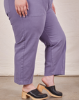 Pant leg close up side view of Petite Short Sleeve Jumpsuit in Faded Grape worn by Ashley