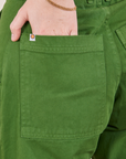 Petite Pencil Pants in Lawn Green back pocket close up. Hana has her hand in the pocket.