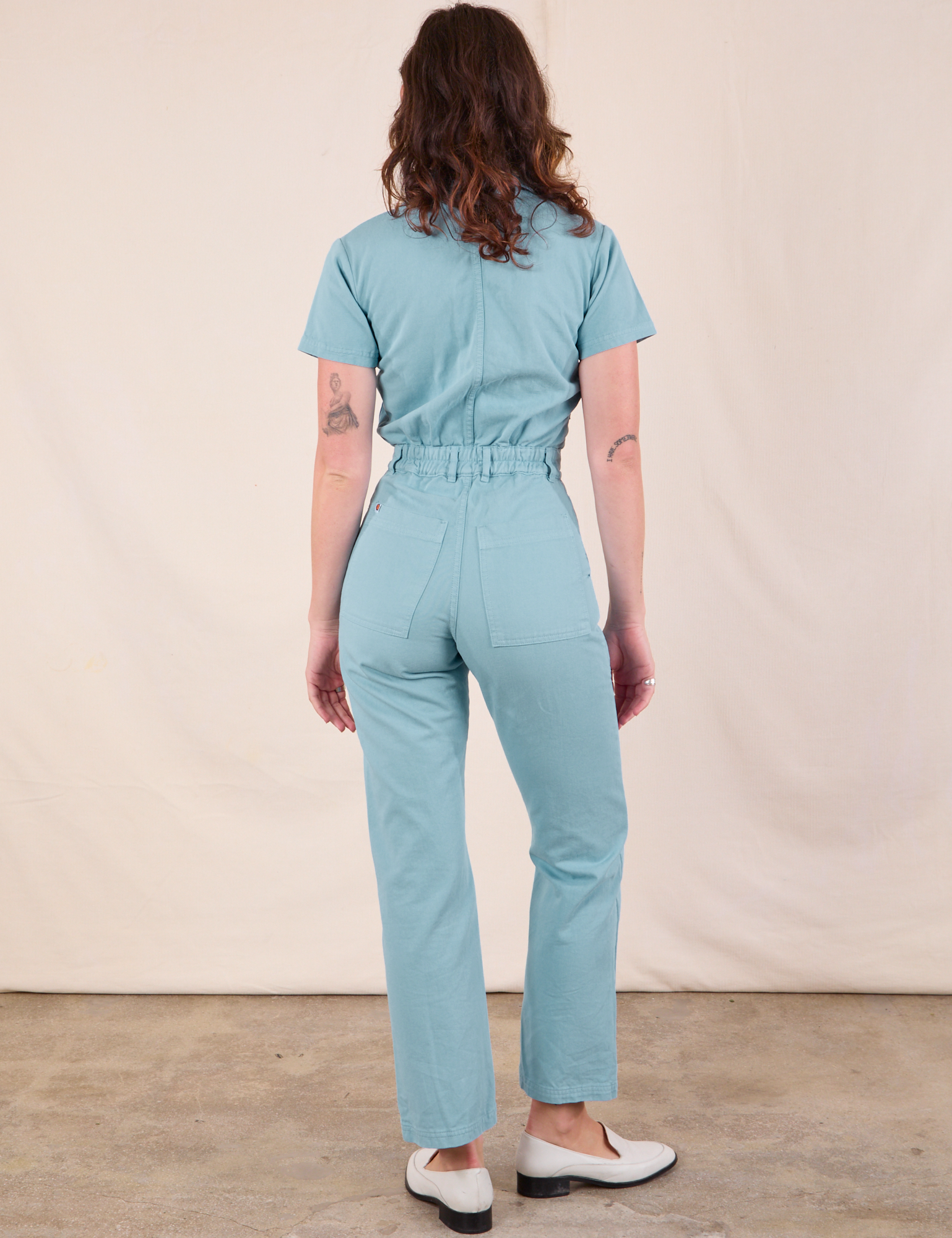 Short Sleeve Jumpsuit in Baby Blue back view on Alex