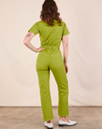 Short Sleeve Jumpsuit in Gross Green back view on Alex