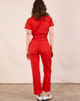 Short Sleeve Jumpsuit in Mustang Red back view on Alex