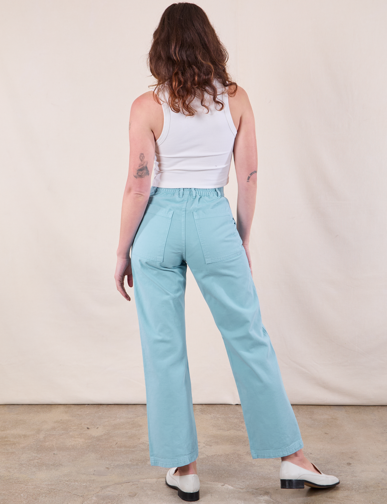 Back view of Work Pants in Baby Blue and Cropped Tank in Vintage Tee Off-White